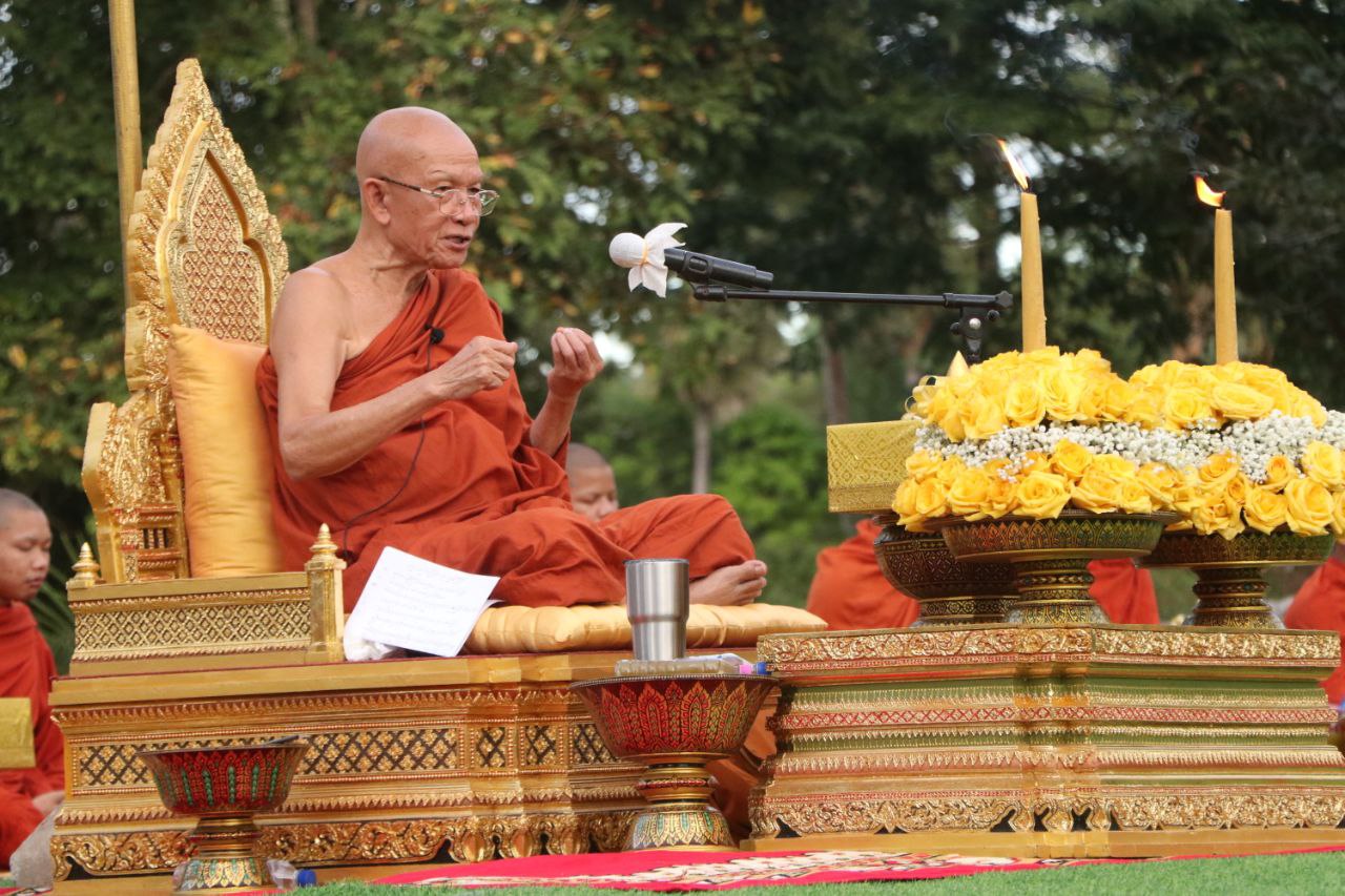 Monks Meditate In Front Of Phnom